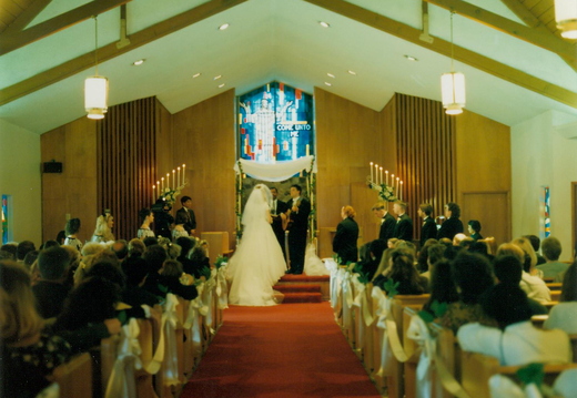 If you squint, you can probably see that I am playing and singing a song I wrote to my lovely bride.  
